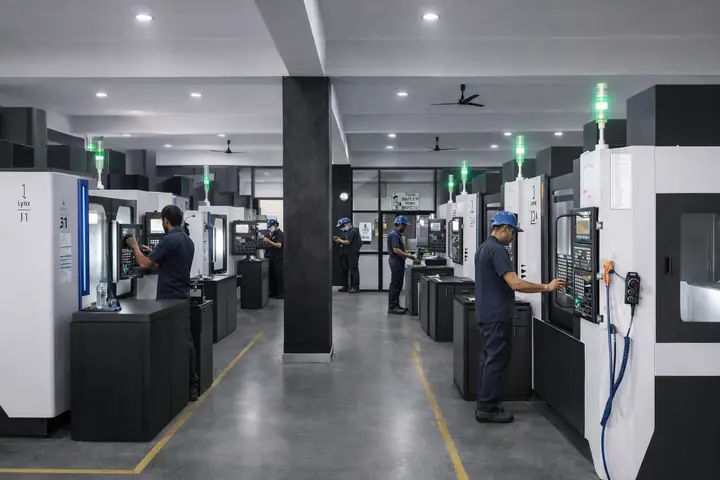 VMC machine shop with operators at work, Unit 1